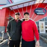 Tommy’s Express Car Wash owners Clayton Wall, left, and Phuong Truong, right, outside of their car wash on Friday, Jan. 16, 2026 in Everett, Washington. (Olivia Vanni / The Herald)