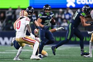 Seattle Seahawks running back Zach Charbonnet carries the ball against the San Francisco 49ers at Lumen Field in Seattle, Washington on Jan. 17, 2026. (Photo courtesy of the Seattle Seahawks)