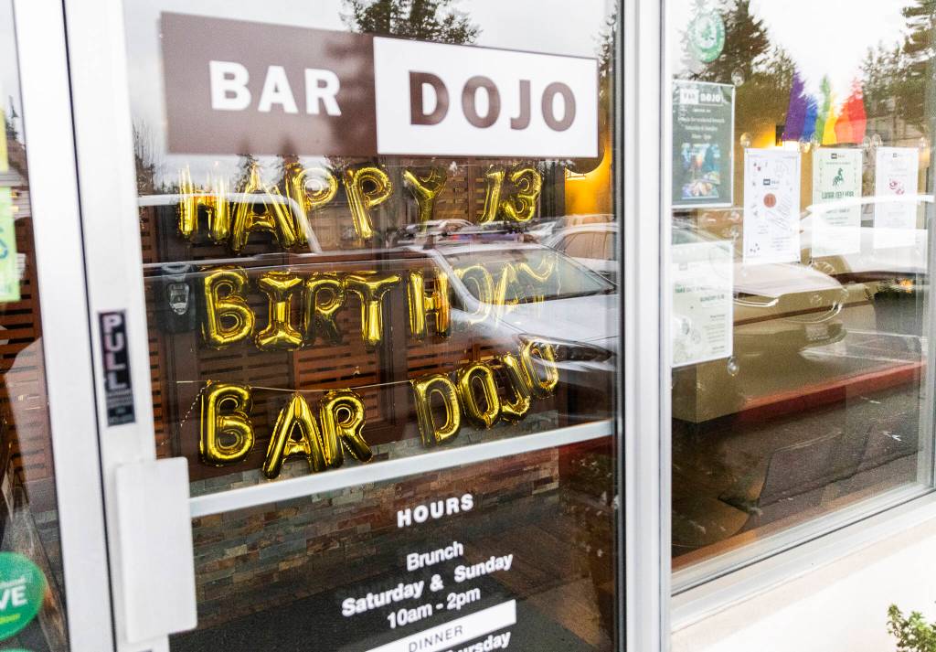 Birthday balloons hang inside Bar Dojo to celebrate the restaurants 13th year in business on Jan. 28 in Edmonds. (Olivia Vanni / The Herald)