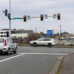 A car idles at a stoplight at the intersection of 196th Street and Poplar Way where the City of Lynnwood will build a bridge over I-5 to connect Poplar Way to Alderwood Mall Boulevard on Monday, Jan. 26, 2026 in Lynnwood, Washington. (Olivia Vanni / The Herald)