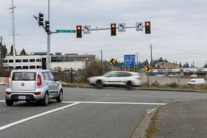 A car idles at a stop light at the intersection of 196th Street and Poplar Way where the City of Lynnwood will be building a bridge over I-5 to connect Poplar Way to Alderwood Mall Boulevard on Monday, Jan. 26, 2026 in Lynnwood, Washington. (Olivia Vanni / The Herald)
