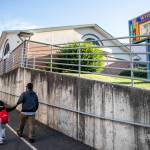 A parent walks a child to class at Whittier Elementary on the first day of school in September 2023 in Everett. Whittier, as with almost all schools in the district, would see upgrades to safety and security, building systems, technology and site improvements if voters pass a bond request in the Feb. 10 special election. (Olivia Vanni / The Herald file photo)