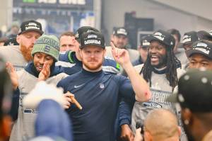Seahawks quarterback Sam Darnold celebrates in Seattle's Lumen Field locker room on Sunday, Jan. 25, 2026. (Photo courtesy of the Seattle Seahawks)