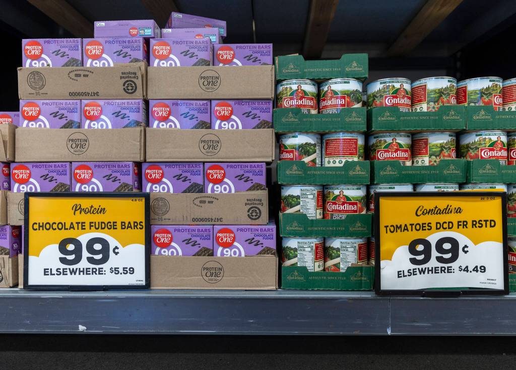 Two price signs show the Grocery Outlet price for the item and the price for the same item Elsewhere on Tuesday, Feb. 10, 2026 in Everett, Washington. (Olivia Vanni / The Herald)