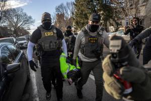 FILE — Federal agents arrest a protester during an active immigration enforcement operation in a Minneapolis neighborhood, Jan. 13, 2026. The chief federal judge in Minnesota excoriated Immigration and Customs Enforcement on Wednesday, Jan. 28, saying it had violated nearly 100 court orders stemming from its aggressive crackdown in the state and had disobeyed more judicial directives in January alone than “some federal agencies have violated in their entire existence.” (David Guttenfelder/The New York Times)