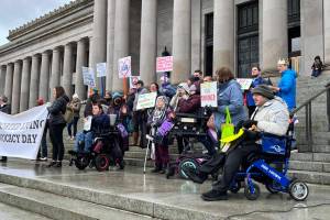Advocates for people with intellectual and developmental disabilities rallied on the state capitol steps on Jan. 17. The group asked for rate increases for support staff and more funding for affordable housing. (Laurel Demkovich/Washington State Standard)