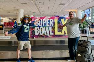 Seahawks fans Daniel Abad (left) and Donald Kracht arrive at San Jose International Airport on their way to Sunday's Super Bowl. (Photo courtesy of Daniel Abad)