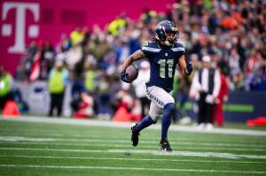Seattle's Jaxon Smith-Njigba (11) runs after a catch during the first half as the Seahawks take on the Arizona Cardinals in an NFL game on Sunday, Nov. 24, 2024, at Lumen Field in Seattle. The Seahawks won 16-6. (Naji Saker/TNS)