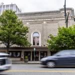 Cars drive along Colby Avenue past the Everett Historic Theater on Tuesday, May 13, 2025 in Everett, Washington. (Olivia Vanni / The Herald)