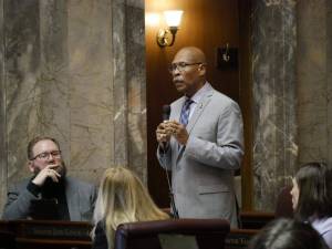 Sen. John Lovick, D-Mill Creek, on the Senate floor on Feb. 12, 2026, remarks about his bill to set stricter standards for sheriffs. The legislation was approved, sending it to the House. (Photo by Bill Lucia/Washington State Standard)