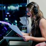Kallie Cullison reads off her game notes on her first radio broadcast for the Everett Silvertips during a 6-3 win against Kamloops at Angel of the Winds Arena on Feb. 6, 2026. (Photo courtesy of Evan Morud / Everett Silvertips)