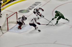 Silvertips forward Henri Ament (right) attempts to get his stick on the puck in front of Tri-City net during Everett's 3-2 win against the Americans at Angel of the Winds Arena on Feb. 22, 2026. (Joe Pohoryles/The Herald)