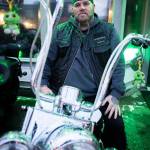 Jeff Turtle Ginnard sits on his bike that has two turtle plushies hanging of the handlebars on March 12, 2026, in Everett. (Olivia Vanni / The Herald)