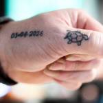 Jeff Turtle Ginnard shows his turtle tattoo next to the date he joined the No Name Riders Motorcycle Club on March 12, 2026, in Everett. (Olivia Vanni / The Herald)