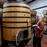 Katie Cochrane talks about how the feeder fits into the process of fermentation at Garden Path Fermentation on Wednesday, Jan. 7, 2026 in Burlington, Washington. (Olivia Vanni / The Herald)