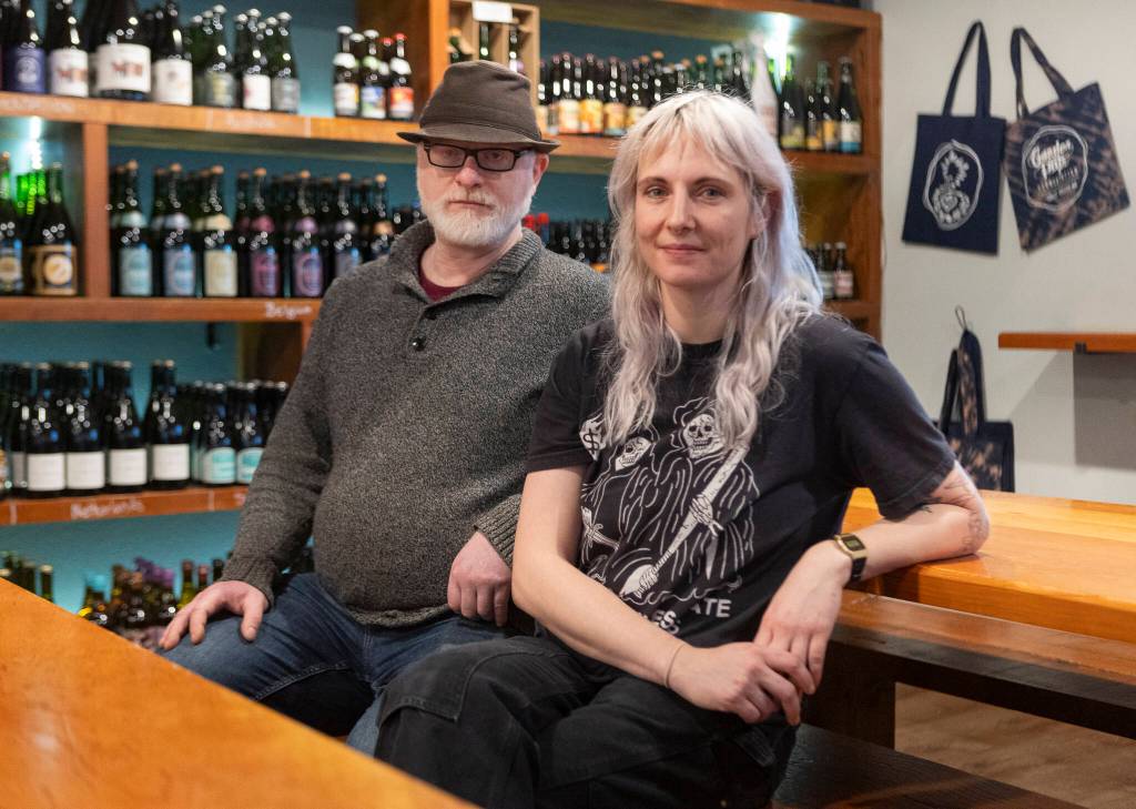 Garden Path Fermentation co-owner Ron Extract and head of production Katie Cochrane inside the tap room on Wednesday, Jan. 7, 2026 in Burlington, Washington. (Olivia Vanni / The Herald)
