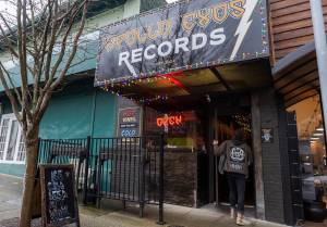 A person walks into Apollo Exos Records on Wednesday, Jan. 7, 2026 in Everett, Washington. (Olivia Vanni / The Herald)