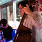 Eric Tran plays bass on March 6 at Butter Notes Cafe in Everett.