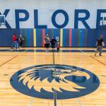 People walk through Explorer Middle Schools new gymnasium during an open house on Oct. 7 in Everett. (Olivia Vanni / The Herald)