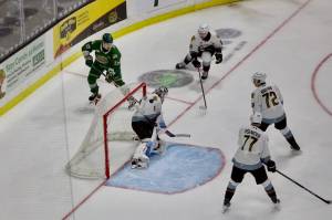Silvertips forward Julius Miettinen tries to flip the puck past Winterhawks goalie Ondrej Štěbeták from behind the net during Everetts 4-1 win against Portland in Game 2 of the WHL Playoffs First Round at Angel of the Winds Arena on March 28, 2026. (Joe Pohoryles / The Herald)