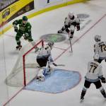 Silvertips forward Julius Miettinen tries to flip the puck past Winterhawks goalie Ondrej Štěbeták from behind the net during Everetts 4-1 win against Portland in Game 2 of the WHL Playoffs First Round at Angel of the Winds Arena on March 28, 2026. (Joe Pohoryles / The Herald)