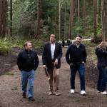 Mountlake Terrace Mayor Steve Woodard, center, walks through Veterans Memorial Park on Thursday in Mountlake Terrace. (Will Geschke / The Herald)