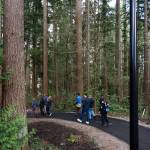 A group tours Veterans Memorial Park on Thursday in Mountlake Terrace. (Will Geschke / The Herald)