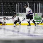 Hackers players warm up before their playoff game at Angel of the Winds Arena on Sunday, March 29, 2026 in Everett, Washington. (Olivia Vanni / The Herald)