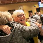 Carolyn Eslick hugs a couple of supporters during a midterm election night watch party on Tuesday, Nov. 8, 2022, at Papas Mexican Grill in Lake Stevens. (Ryan Berry / The Herald)