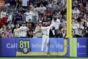 Jo Adell (7) of the Los Angeles Angels catches a fly out by J.P. Crawford of the Seattle Mariners during the ninth inning of a baseball game at Angel Stadium of Anaheim on Saturday in Anaheim, California. (Ryan Sirius Sun / Getty Images / The Athletic)