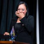 The 2026 Emerging Leaders winner Yuliana Flores-Montes begins crying as she walks to the podium during the award event on Tuesday, April 7, 2026, in Everett, Washington. (Olivia Vanni / The Herald)