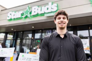 Starbuds owner Kaden Sadis outside of their newly opened Lynnwood location on Monday, April 20, 2026 in Lynnwood, Washington. (Olivia Vanni / The Herald)