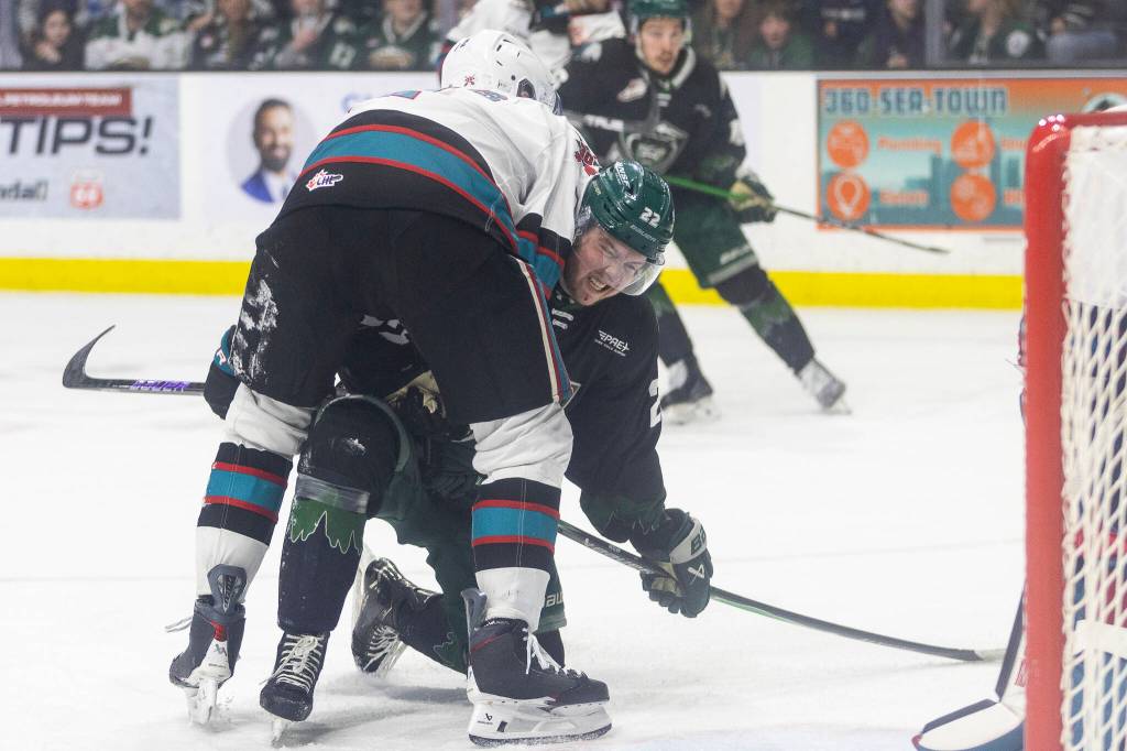 Jesse Heslop #22 of the Everett Silvertips is held down by Keith McInnis #2 of the Kelowna Rockets during Game 5 of the Western Hockey League second round on Friday, April 17, 2026 in Everett, Washington. (Olivia Vanni / The Herald)