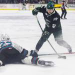 Lukas Kaplan #12 of the Everett Silvertips shoots the puck past Nate Corbet #22 of the Kelowna Rockets during Game 5 of the Western Hockey League second round on Friday, April 17, 2026 in Everett, Washington. (Olivia Vanni / The Herald)