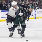 Rowan Guest #26 of the Kelowna Rockets and Lukas Kaplan #12 of the Everett Silvertips battle for the puck during Game 5 of the Western Hockey League second round on Friday, April 17, 2026 in Everett, Washington. (Olivia Vanni / The Herald)