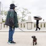 Pedestrians, including the Ivars clam, walk across the new Edgewater Bridge on Monday, April 27, 2026, in Everett, Washington. (Olivia Vanni / The Herald)