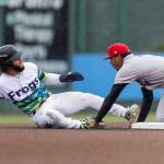 Carlos Jimenez #14 of the Everett AquaSox is tagged out after sliding into second base during the game against the Spokane Indians on Tuesday, April 21, 2026 in Everett, Washington. (Olivia Vanni / The Herald)