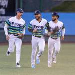 Jonny Farmelo #15 of the Everett AquaSox, Axel Sanchez #21 of the Everett AquaSox and Carlos Jimenez #14 of the Everett AquaSox run in from the outfield during the game against the Spokane Indians on Tuesday, April 21, 2026 in Everett, Washington. (Olivia Vanni / The Herald)