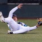 Jonny Farmelo #15 of the Everett AquaSox just misses a catch in the outfield during the game against the Spokane Indians on Tuesday, April 21, 2026 in Everett, Washington. (Olivia Vanni / The Herald)