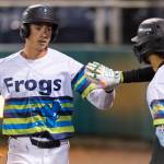 Jonny Farmelo #15 of the Everett AquaSox high-fives Axel Sanchez #21 of the Everett AquaSox after during the sixth inning against the Spokane Indians on Tuesday, April 21, 2026 in Everett, Washington. (Olivia Vanni / The Herald)
