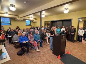 Snohomish resident Anne Masterson speaks to the City Council about the Pride parade in front of a packed house on Tuesday, April 22, 2026. (Taylor Scott Richmond / The Herald)