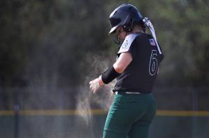 Jackson’s 	Coralynn Augustine brushes dirt off of her jersey during the game against Kamiak on Monday, April 20, 2026 in Mill Creek, Washington. (Olivia Vanni / The Herald)
