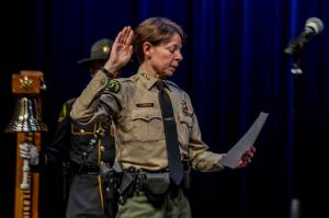 Annie Barker / The Herald
Snohomish County Sheriff Susanna Johnson swears in colleagues during the ceremonial oath of office at the PUD auditorium in Everett on Jan. 2, 2024. On Monday, Johnson announced her plans to seek reelection.
