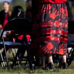 A ribbon skirt covered in red handprints is illuminated by the sun during a rally honoring missing and murdered Indigenous people on Tuesday, May 5, 2026, in Tulalip, Washington. (Olivia Vanni / The Herald)