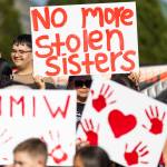 Cynthia Leon-Ortiz holds a sign reading, No more stolen sisters, during a rally in honor of missing and murdered Indigenous people on Tuesday, May 5, 2026, in Tulalip, Washington. (Olivia Vanni / The Herald)