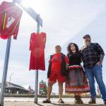 Monie Ordonia, left to right, Skaweets Sarah Hart, and Anthony Hart stand next to a Missing and Murdered Indigenous People display they have organized and curated to create awareness for those who are currently missing or have been murdered on Monday, May 4, 2026 in Tulalip, Washington. (Olivia Vanni / The Herald)
