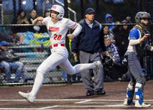 Stanwoods Addi Anderson yells as she crosses home plate to score the go-ahead run during the 3A District 1 championship game against Sedro-Woolley on Thursday, May 15, 2025 in Everett, Washington. (Olivia Vanni / The Herald)
Stanwoods Addi Anderson yells as she crosses home plate to score the go-ahead run during the 3A District 1 championship game against Sedro-Woolley on Thursday, May 15, 2025 in Everett, Washington. (Olivia Vanni / The Herald)