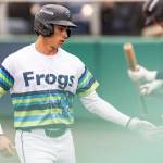 Jonny Farmelo #15 of the Everett AquaSox high-fives a teammate after scoring during the game against the Hillsboro Hops on Wednesday, May 6, 2026 in Everett, Washington. (Olivia Vanni / The Herald)