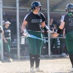 Aliana Langsea high-fives a teammate before stepping up to the plate during a game against Kamiak on April 20 in Mill Creek. (Olivia Vanni / The Herald)