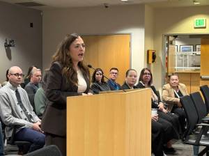 Spanish interpreter Iratxe Cardwell speaks to the Snohomish County Council before they vote on a resolution recognizing Court Interpreter Appreciation Day on Wednesday. (Taylor Scott Richmond / The Herald)